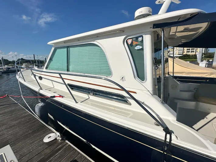 Tlc Yacht Photos Pics 2014 Back Cove 37 boat docked at marina under clear blue sky.