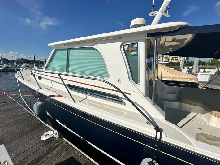 Tlc Yacht Photos Pics 2014 Back Cove 37 yacht docked at marina under clear blue sky.