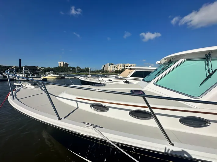 Tlc Yacht Photos Pics 2014 Back Cove 37 yacht docked under clear blue sky.