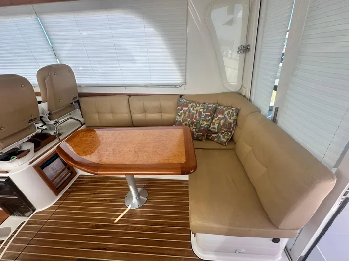 Tlc Yacht Photos Pics Luxurious interior of 2014 Back Cove 37 yacht with beige seating and wooden table.