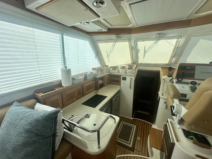 Tlc Yacht Photos Pics Interior of 2014 Back Cove 37 yacht with modern kitchen and navigation area.