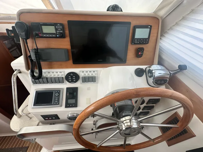 Tlc Yacht Photos Pics Helm of 2014 Back Cove 37 boat with steering wheel and navigation equipment.