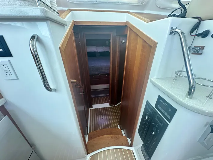 Tlc Yacht Photos Pics Interior view of 2014 Back Cove 37 yacht, featuring wooden steps and cabin entrance.