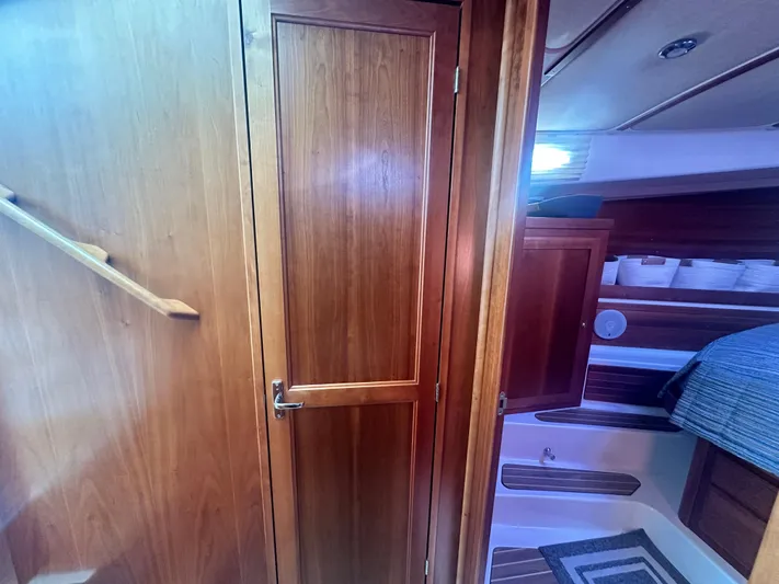 Tlc Yacht Photos Pics Interior of 2014 Back Cove 37 yacht with wooden cabinetry and cozy sleeping area.