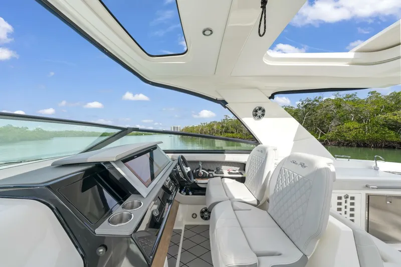  Yacht Photos Pics 2022 Sea Ray SLX 400 Outboard cockpit with luxurious seating and modern dashboard.