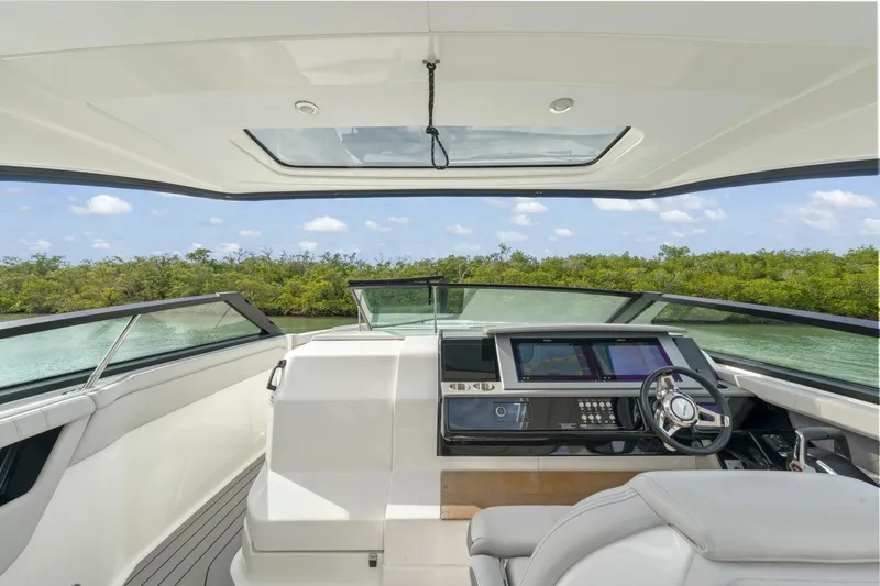  Yacht Photos Pics Interior view of 2022 Sea Ray SLX 400 Outboard boat cockpit with modern controls.
