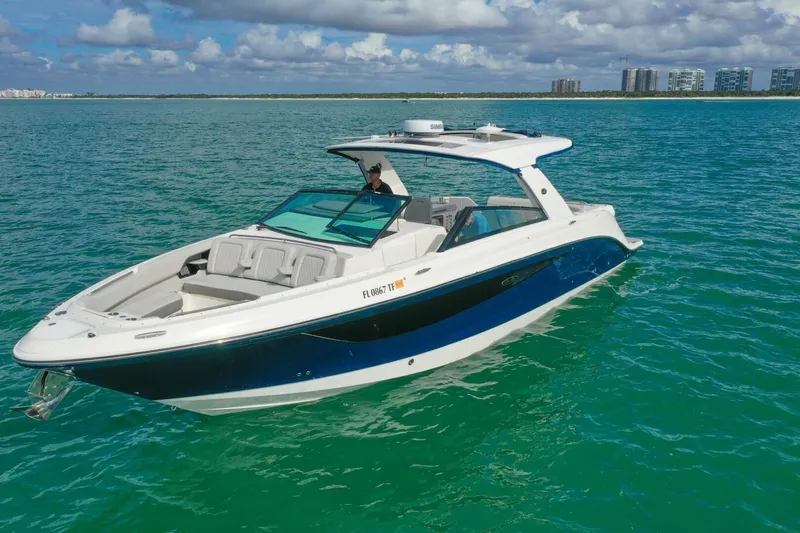  Yacht Photos Pics 2022 Sea Ray SLX 400 Outboard boat cruising on clear blue water.