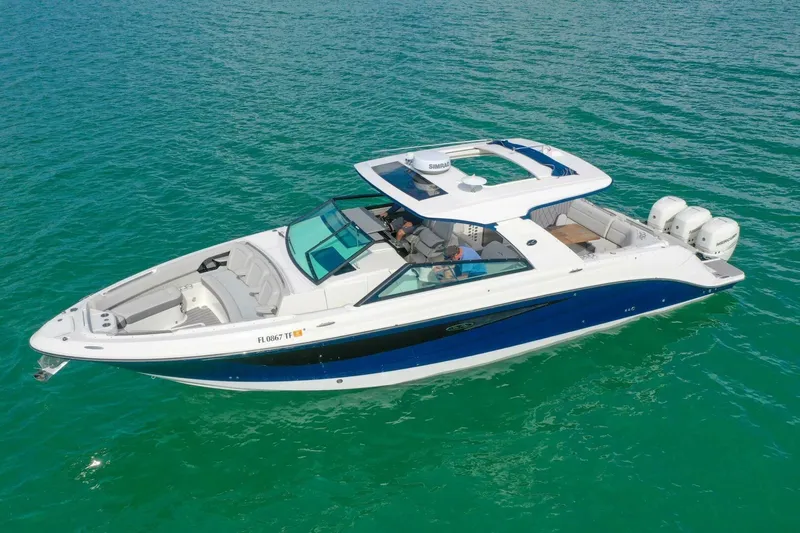  Yacht Photos Pics 2022 Sea Ray SLX 400 Outboard cruising on clear turquoise water.