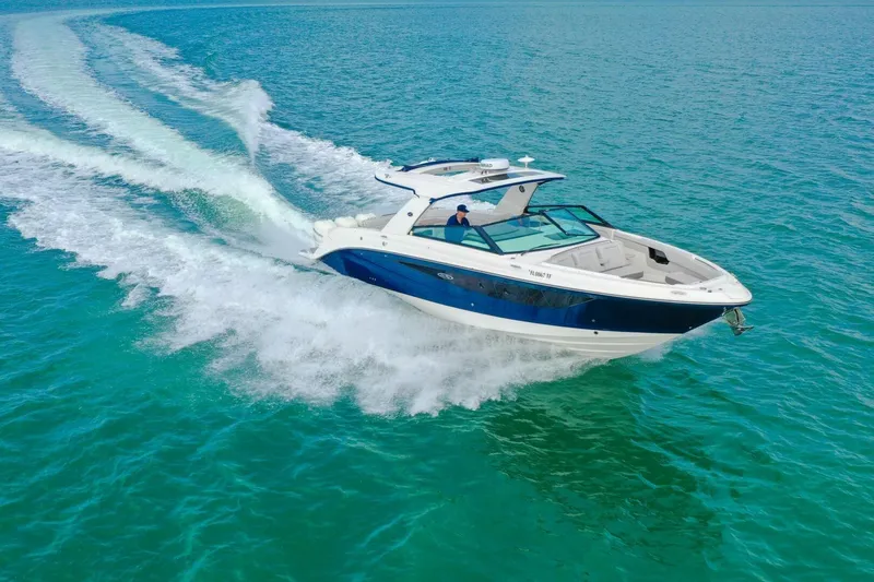  Yacht Photos Pics 2022 Sea Ray SLX 400 Outboard cruising on clear blue water.