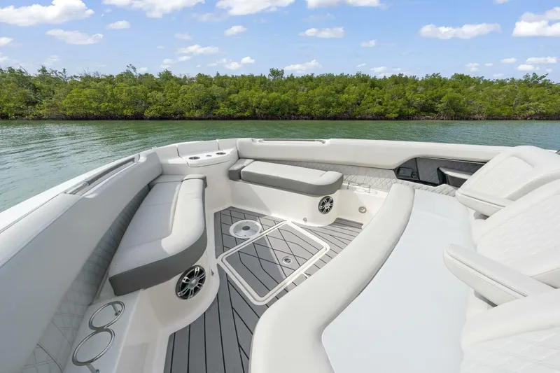  Yacht Photos Pics 2022 Sea Ray SLX 400 Outboard boat interior with luxurious seating and scenic water view.