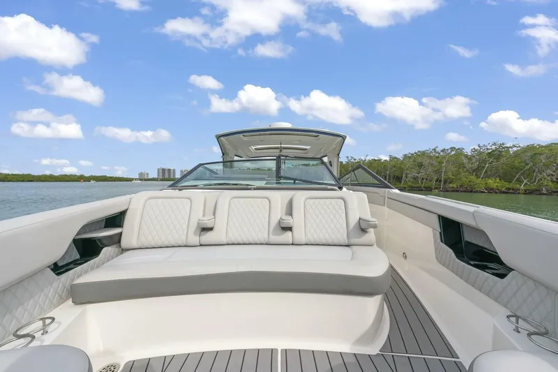 Yacht Photos Pics 2022 Sea Ray SLX 400 Outboard boat interior with luxurious seating, scenic water view.