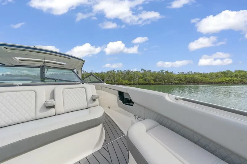  Yacht Photos Pics 2022 Sea Ray SLX 400 Outboard boat interior with luxurious seating, scenic water view.
