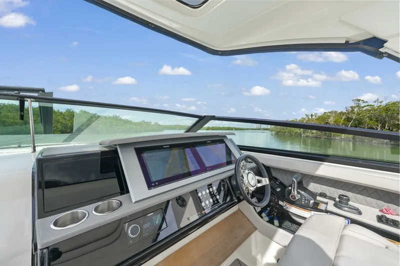  Yacht Photos Pics 2022 Sea Ray SLX 400 Outboard helm with modern controls and scenic water view.