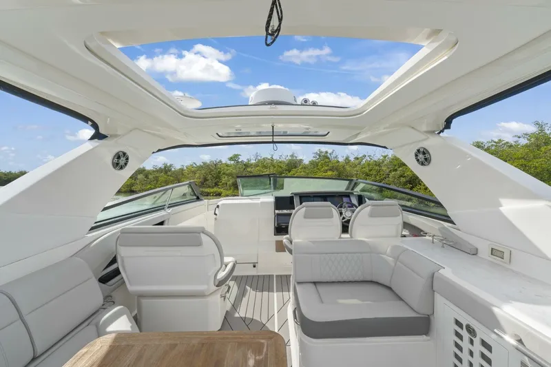  Yacht Photos Pics 2022 Sea Ray SLX 400 Outboard interior with luxurious seating and open roof design.
