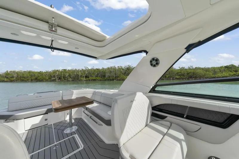  Yacht Photos Pics Luxurious interior of 2022 Sea Ray SLX 400 Outboard with scenic water view.