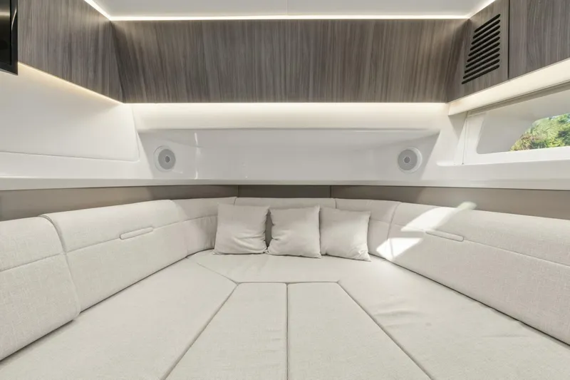 Yacht Photos Pics 2022 Sea Ray SLX 400 Outboard interior with modern seating and cushions.