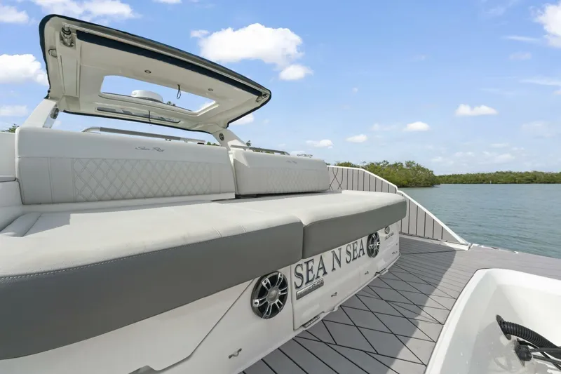  Yacht Photos Pics 2022 Sea Ray SLX 400 Outboard luxury boat with spacious seating on a sunny day.