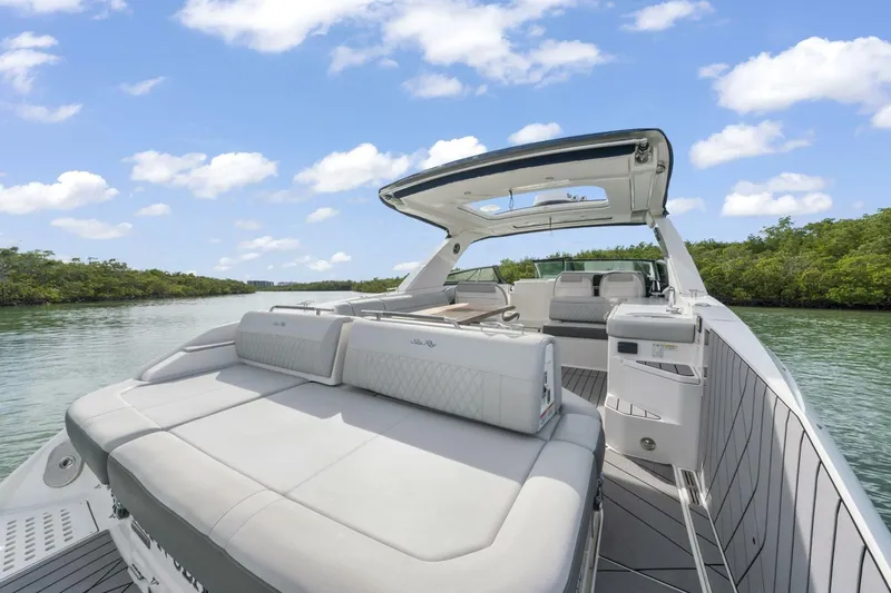  Yacht Photos Pics 2022 Sea Ray SLX 400 Outboard luxury boat on a serene waterway.