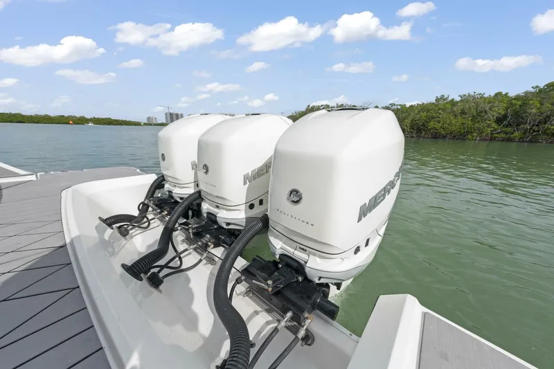  Yacht Photos Pics 2022 Sea Ray SLX 400 Outboard with triple Mercury engines on calm water.