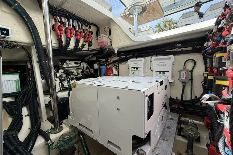  Yacht Photos Pics Engine room of 2022 Sea Ray SLX 400 Outboard with complex wiring and equipment.