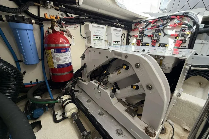  Yacht Photos Pics Engine compartment of 2022 Sea Ray SLX 400 Outboard with fire extinguisher and wiring.