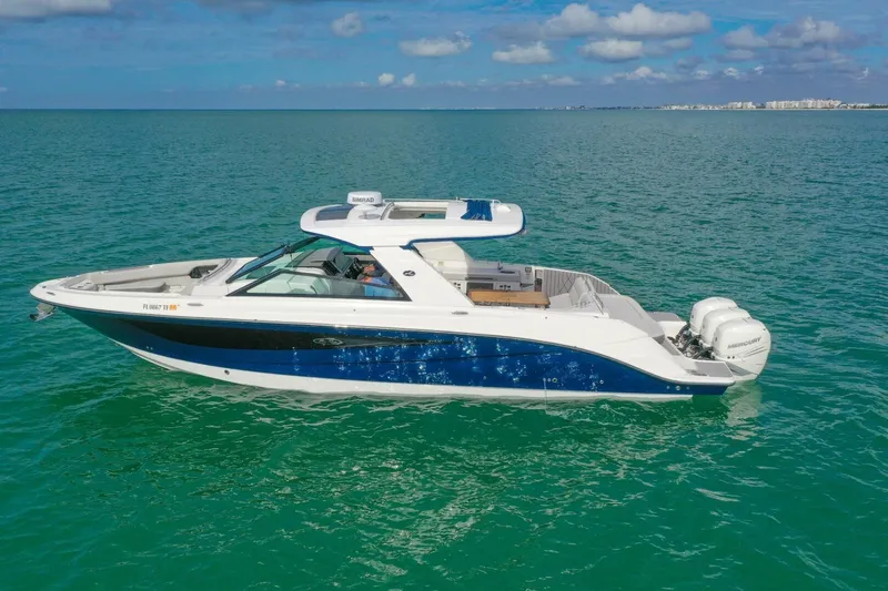  Yacht Photos Pics 2022 Sea Ray SLX 400 Outboard cruising on clear blue ocean waters.