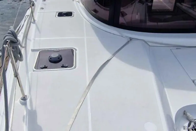  Yacht Photos Pics 2024 Lagoon 42 catamaran deck with sleek design and modern features.