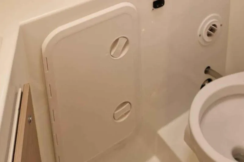  Yacht Photos Pics 2024 Lagoon 42 yacht bathroom interior with compact design and modern fixtures.