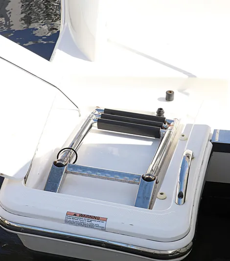  Yacht Photos Pics 2021 Tiara Sport 34 LX boat ladder, stainless steel, folded on deck.
