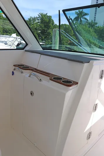  Yacht Photos Pics 2021 Tiara Sport 34 LX boat interior with cup holders and window view.