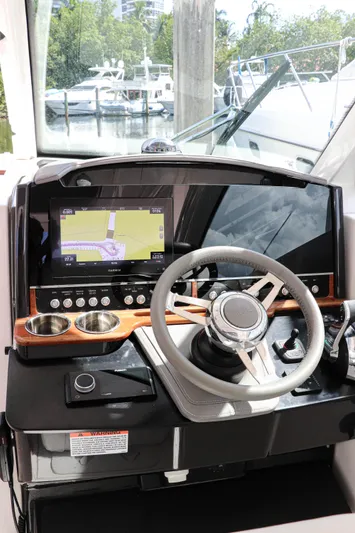  Yacht Photos Pics 2021 Tiara Sport 34 LX helm with modern navigation display and steering wheel.