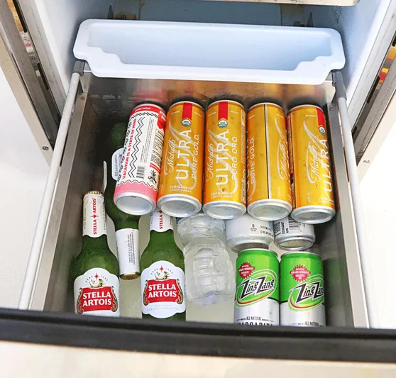  Yacht Photos Pics Refrigerator drawer with assorted beverages, including Stella Artois and Michelob Ultra, on a Tiara Sport 34 LX.