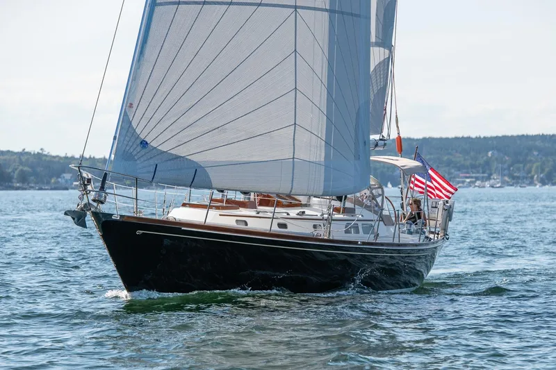 Golden Eye Yacht Photos Pics Sailing yacht Hinckley Sou'wester 42 MKII 1996 on open water with American flag.