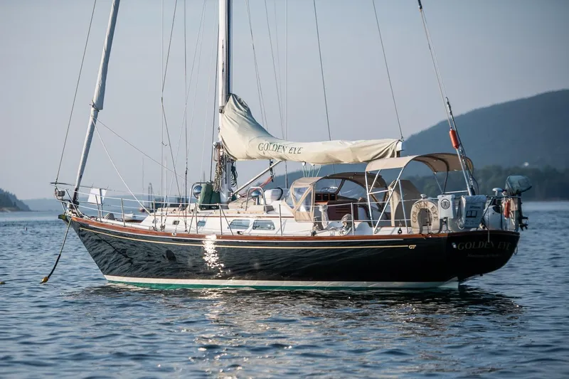 Golden Eye Yacht Photos Pics 1996 Hinckley Sou'wester 42 MKII sailboat on calm water, scenic background.
