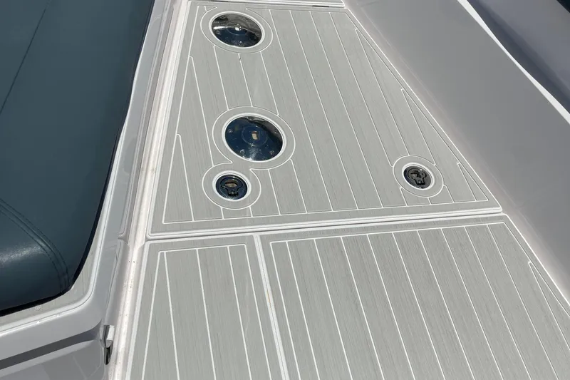Squirt Yacht Photos Pics 2023 Axopar 28 CABIN deck with sleek design and integrated fixtures.