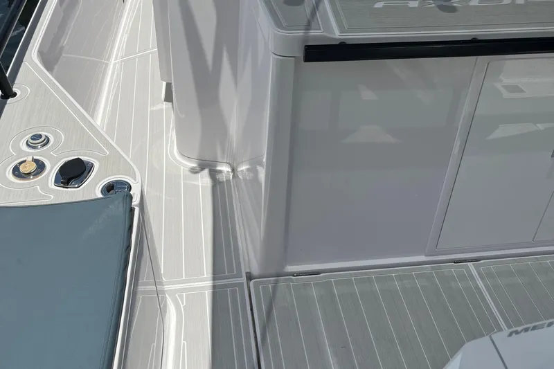 Squirt Yacht Photos Pics 2023 Axopar 28 CABIN boat interior with sleek design and modern controls.