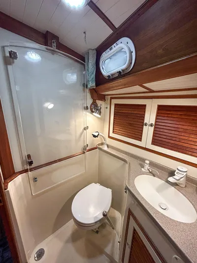 Golden Eye Yacht Photos Pics 1996 Hinckley Sou'wester 42 MKII yacht bathroom with shower, toilet, and sink.