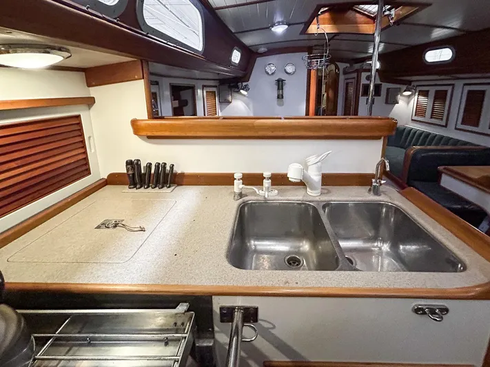 Golden Eye Yacht Photos Pics Interior of 1996 Hinckley Sou'wester 42 MKII yacht, featuring a well-equipped kitchen area.