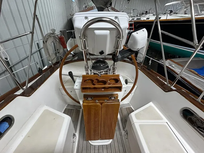 Golden Eye Yacht Photos Pics Cockpit of 1996 Hinckley Sou'wester 42 MKII sailboat with wooden helm and seating.