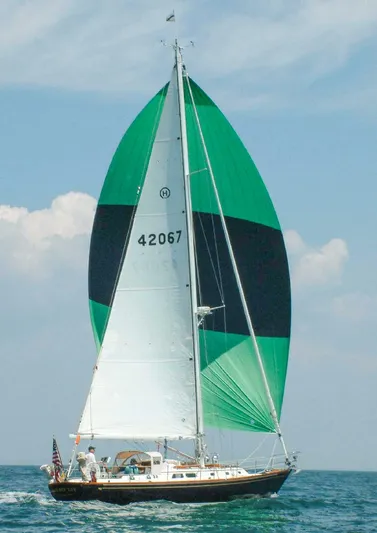 Golden Eye Yacht Photos Pics Sailing yacht Hinckley Sou'wester 42 MKII, 1996, with green and black sails on open water.