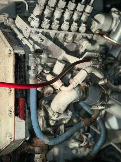  Yacht Photos Pics Engine components of a 2000 Bayliner 4788 Pilot House Motoryacht, featuring hoses and connectors.