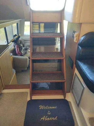  Yacht Photos Pics Interior of 2000 Bayliner 4788 Pilot House Motoryacht with stairs and welcome mat.
