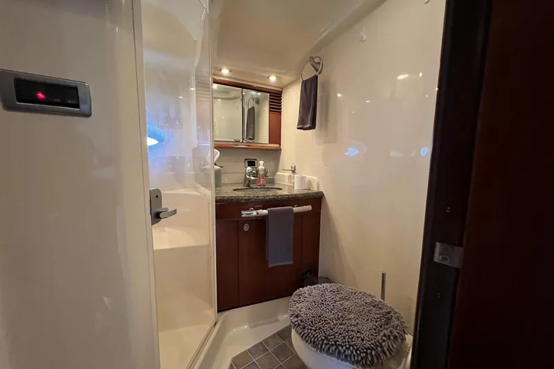Nautical Dreamer Yacht Photos Pics Luxurious bathroom in 2005 Sea Ray 500 Sundancer yacht with modern amenities.