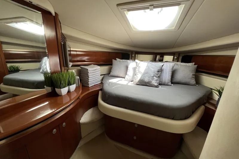 Nautical Dreamer Yacht Photos Pics Luxurious cabin interior of 2005 Sea Ray 500 Sundancer yacht with elegant bedding.