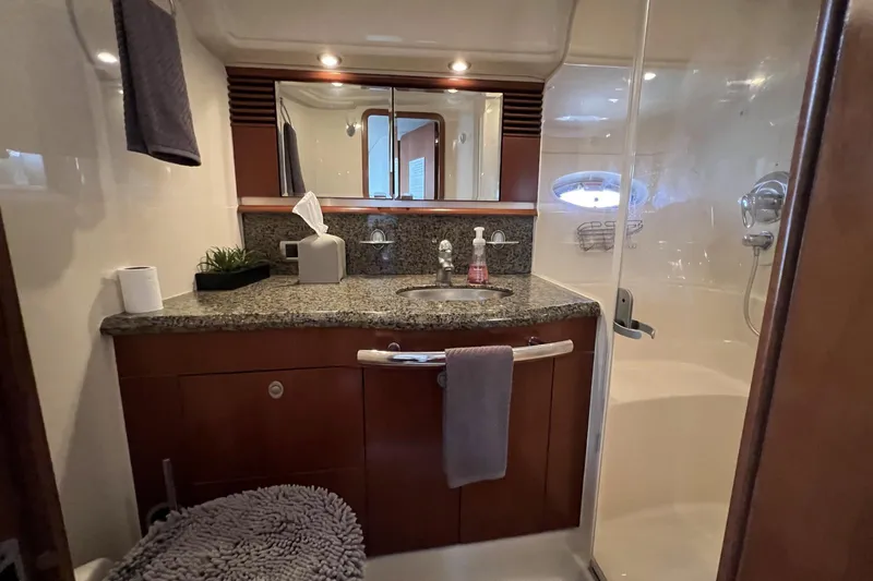 Nautical Dreamer Yacht Photos Pics Luxurious bathroom in 2005 Sea Ray 500 Sundancer yacht with granite countertop and shower.
