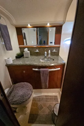 Nautical Dreamer Yacht Photos Pics Luxurious bathroom in 2005 Sea Ray 500 Sundancer yacht with granite countertop and modern fixtures.