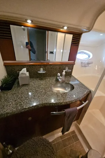 Nautical Dreamer Yacht Photos Pics Luxurious bathroom in 2005 Sea Ray 500 Sundancer yacht with granite countertop and modern fixtures.