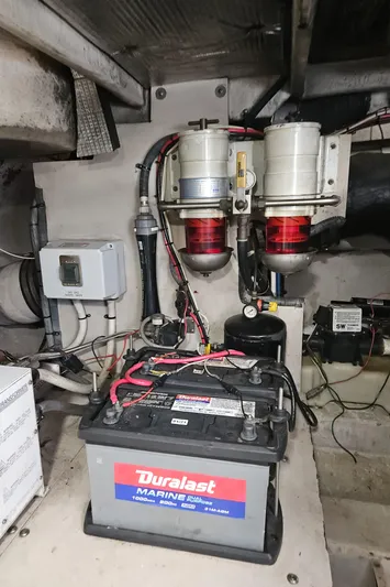 Nautical Dreamer Yacht Photos Pics Engine room of 2005 Sea Ray 500 Sundancer with Duralast marine battery and fuel filters.