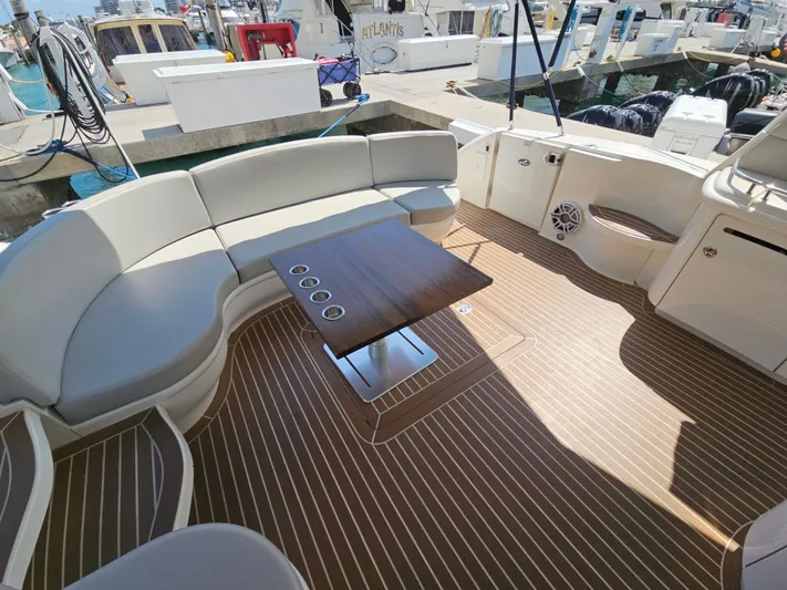 Nautical Dreamer Yacht Photos Pics Spacious deck of 2005 Sea Ray 500 Sundancer with elegant seating and wooden table.