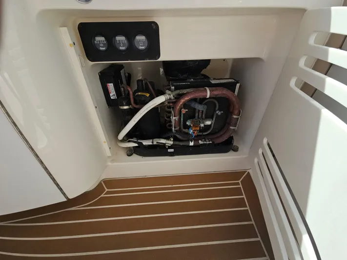Nautical Dreamer Yacht Photos Pics Engine compartment of 2005 Sea Ray 500 Sundancer with visible components and controls.